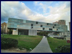 Central part - Benidorm City Hall (Ayuntamiento), a futuristic building that seems to be hovering above the ground.