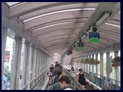 Central-Mid-Levels Escalator, first, lower, part near Central Market.  Because of rush hour, the escalators run downhill between 6 and 10 in the morning, and uphill the rest of the day. It has been in operation since 1993.