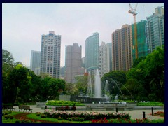 The Garden Fountain in Hong Kong Zoo and Botanical garden with the skyline in the background.