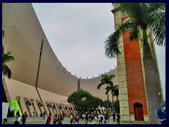 Cultural Center, situated between Salisbury Road and Victoria Harbour, opened in 1989 by Prince Charles and Princess Diana, at the site of the former Kowloon Station, a historic railway station that where torn down. Only the clock tower was preserved, a big controversy at the time. The Cultural Centre has a concert hall with over 2000 seats, two theatres, exhibition gallery and rehearsal rooms.