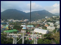 Cable cars above Ocean Park takes visitors from The Summit to The Highland on the other side of mountains.