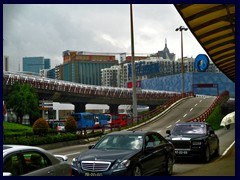 Luxury cars passing Macau Outer Harbour.