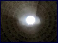 Pantheon is famous for it's dome with a hole on the top, called the Oculus, where sunlight ("the light of God") is shining down on the floor on sunny days.