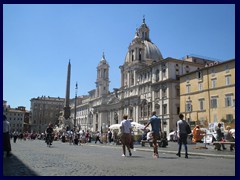 Piazza Navona is one of the most famous, and probably the most beautiful square in Rome. It was built on the site of the old oval shaped Stadium of Domitian from the 1st century AD. The white church is Sant'Agnese in Agone and the obelisk belongs to the Fountain of the Four Rivers.