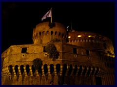 Castel Sant'Angelo is illuminated at night.