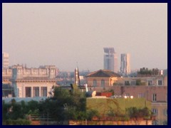 Views of Rome from Pincio Hill:  Torre Eurosky (155m) and Torre Europarco (120m). To the left is Palazzo della Civiltà Italiana. The modern dome church to the right is called Basilica dei Santi Pietro e Paolo all' EUR.