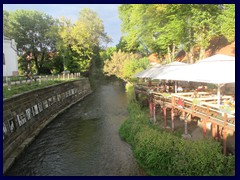 The Vilnia River borders to Uzupis from the Bernardine Garden in the Old Town.